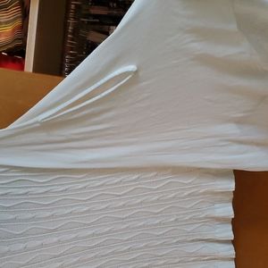 White sweater with fun unique sleeves.